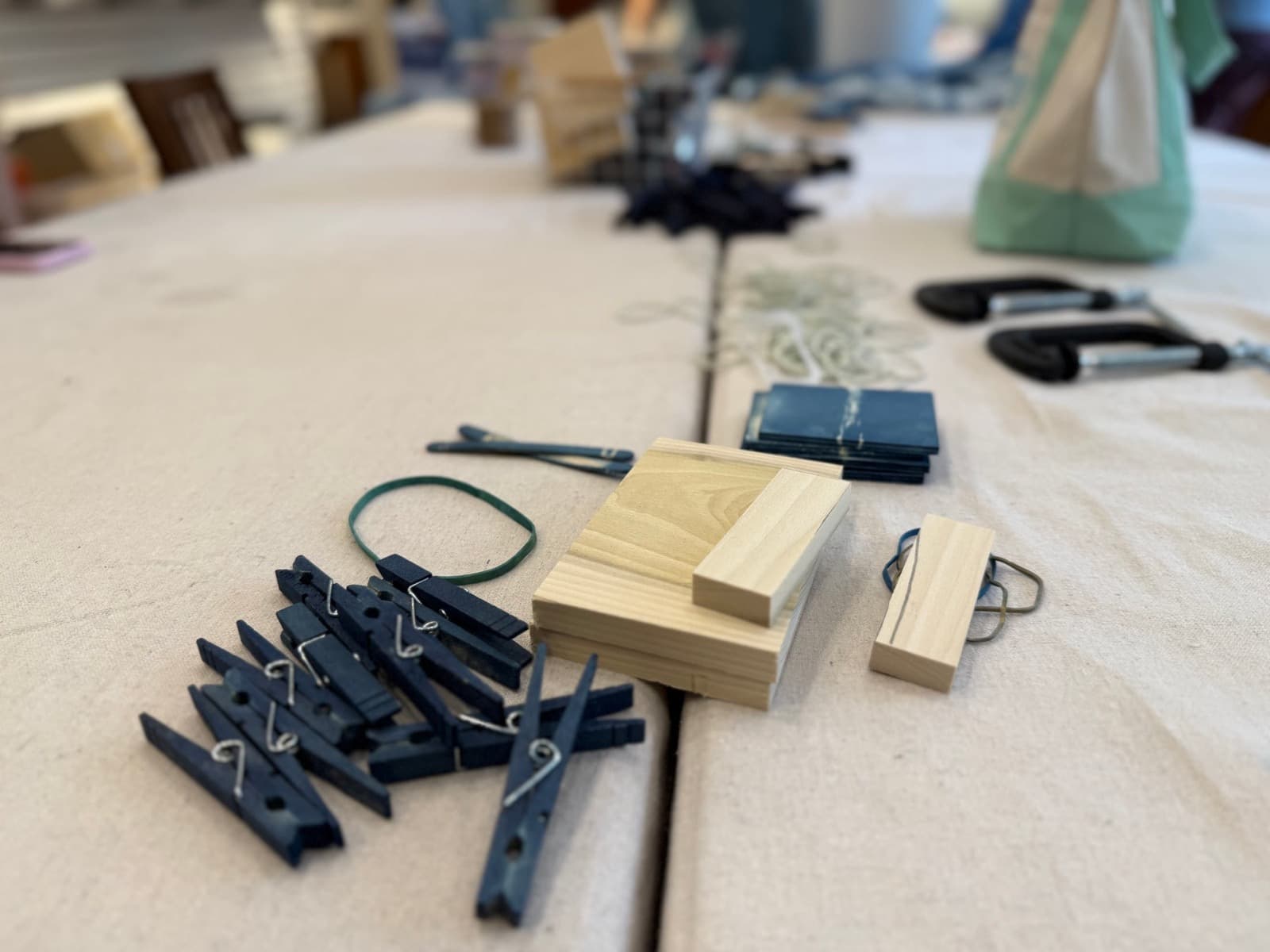 Clothespins, wood blocks and dyeing tools arranged on a Handcraft Revival worktable
